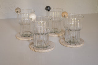 Amer Drink Charms on Rim of Meena Fluted Tumblers with Nayarit Coasters in Cream Travertine