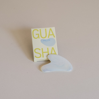 Opalite Gua Sha Leaning on Box