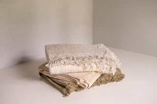 Brisbane Throw Blanket in All Colors Stacked
