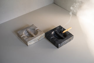 Roca Ashtrays in Amber and Black with Smoking Incense in the Black Tray