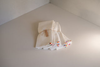 Stacked Caladesi Linen Napkin Sets in Ivory 