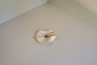 Stowe Ceramic Tray in White Checkered with Palo Santo Stick Resting On It