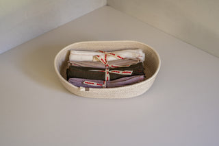 Halsted Woven Bread Basket Top View with Madre Linen Tea Towels Inside
