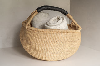 Osu Shopper Basket with Brisbane Throw Blankets in Natural Speckle Rolled Inside 