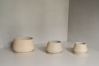 Aviara Planters with Saucers in All Sizes in a Row
