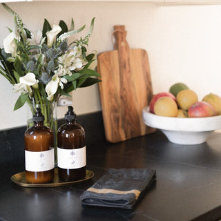 Navy Malabar Cotton Cloth on Counter Next To Jack's Daughter Soap and Lotion on Suna Tray