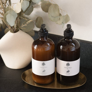 Jack's Daughters Santal Noir No. 1 Soap and Lotion Jars on Suna Brass Tray on Counter Next to Alta Vase