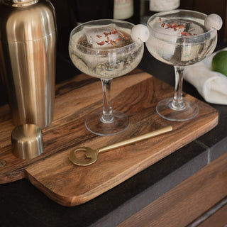 Lodhi Bottle Opener On Bardwell Bread Board with May Cocktail Shaker and Coupe Glasses