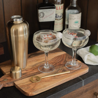 May Cocktail Shaker on Bardwell Bread Board with Lodhi Bottle Opener and Cocktails in Coupe Glasses