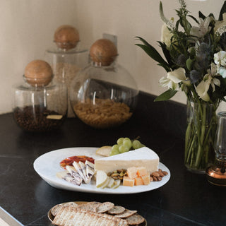 Yamuna Orb Canisters on Counter with Coffee Beans, Rolled Oats, and Pasta Inside Next to Our Oaxaca Cheese Platter